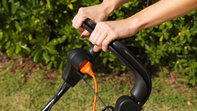 Honda HRE-grasmaaiers, close-up van onderbreking, tuinlocatie.