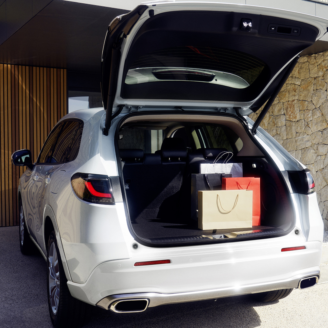 White ZR-V boot open in drive way