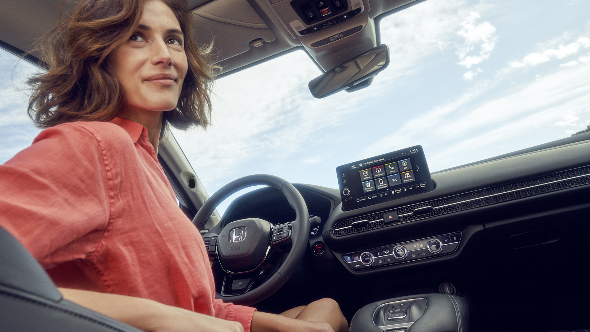 Woman in drivers seat looking back