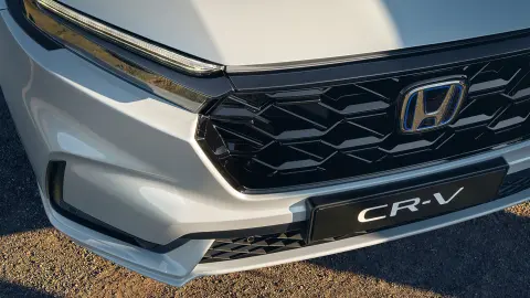 CR-V Hybrid SUV close-up van mesh grille vooraan.
