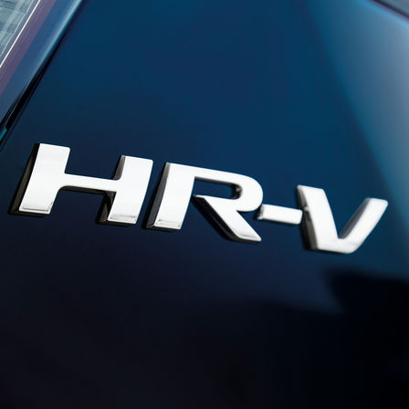 Close-up Honda HR-V logo.