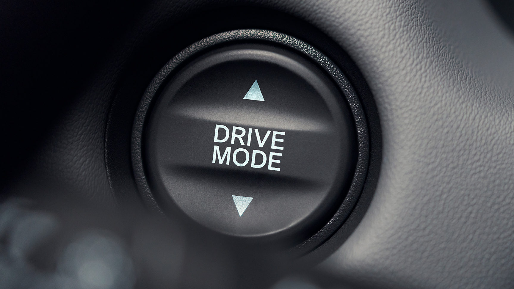 Close-up van de knop voor de rijmodus met witte tekst