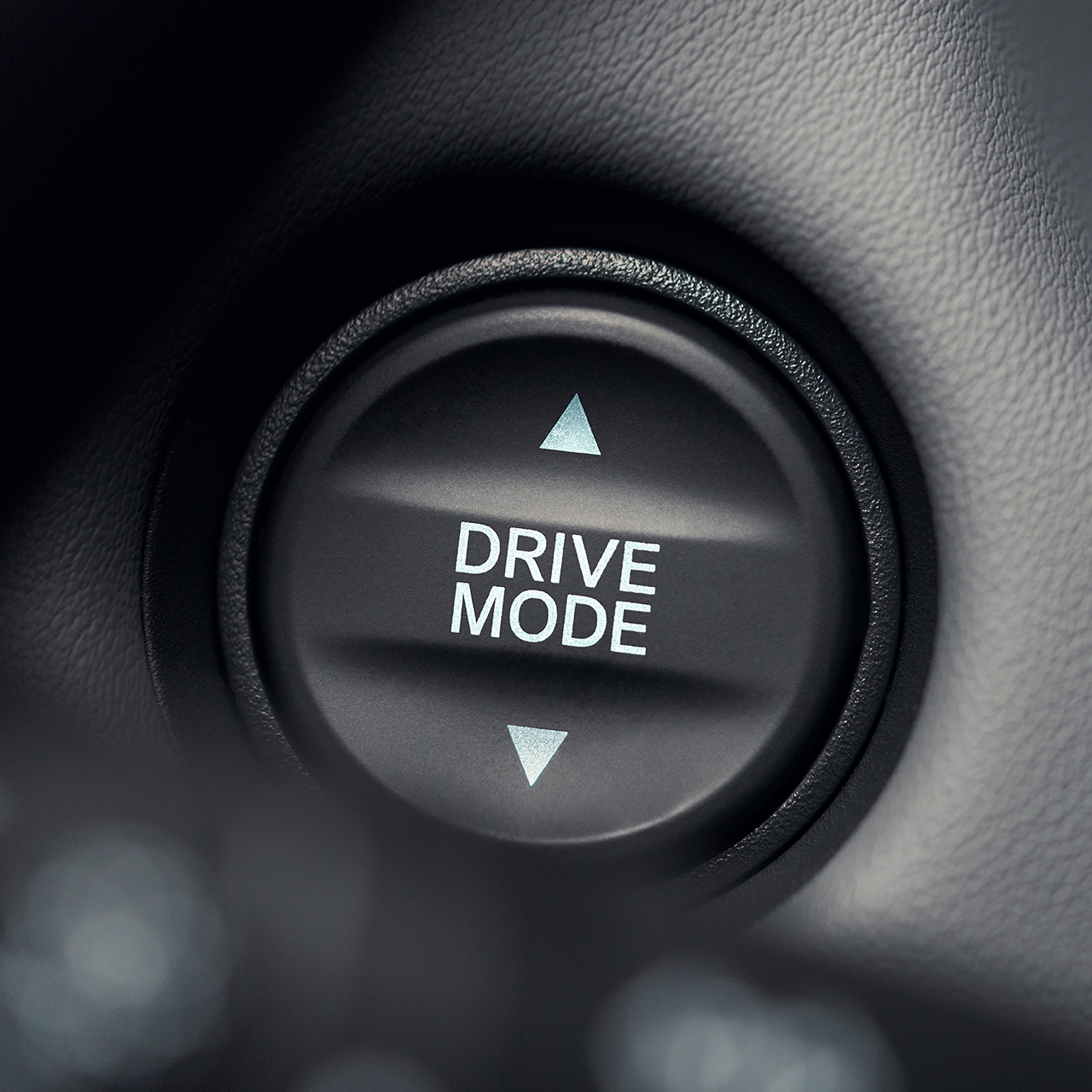 Close-up van de knop voor de rijmodus met witte tekst