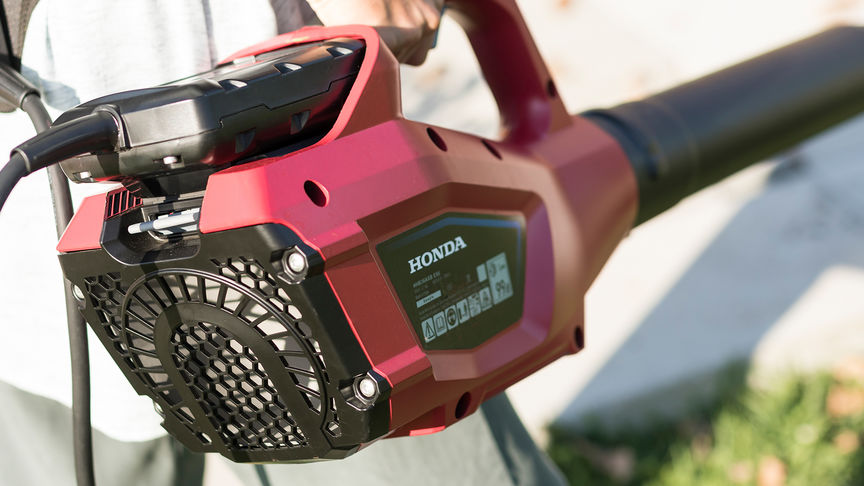 Close up view of Honda leaf blower with battery attached.
