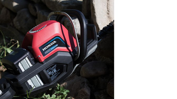 Close up of Honda cordless hedge trimmer battery and motor.
