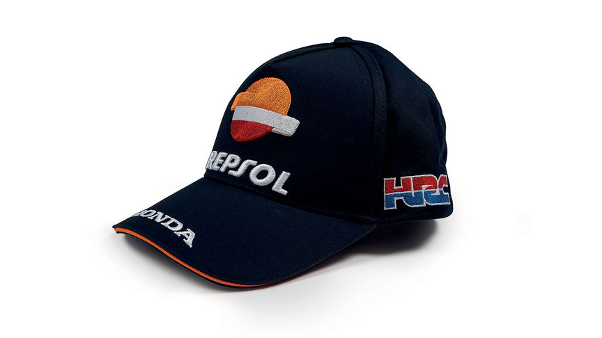 Blauwe cap met MotoGP-teamkleuren en Repsol logo.