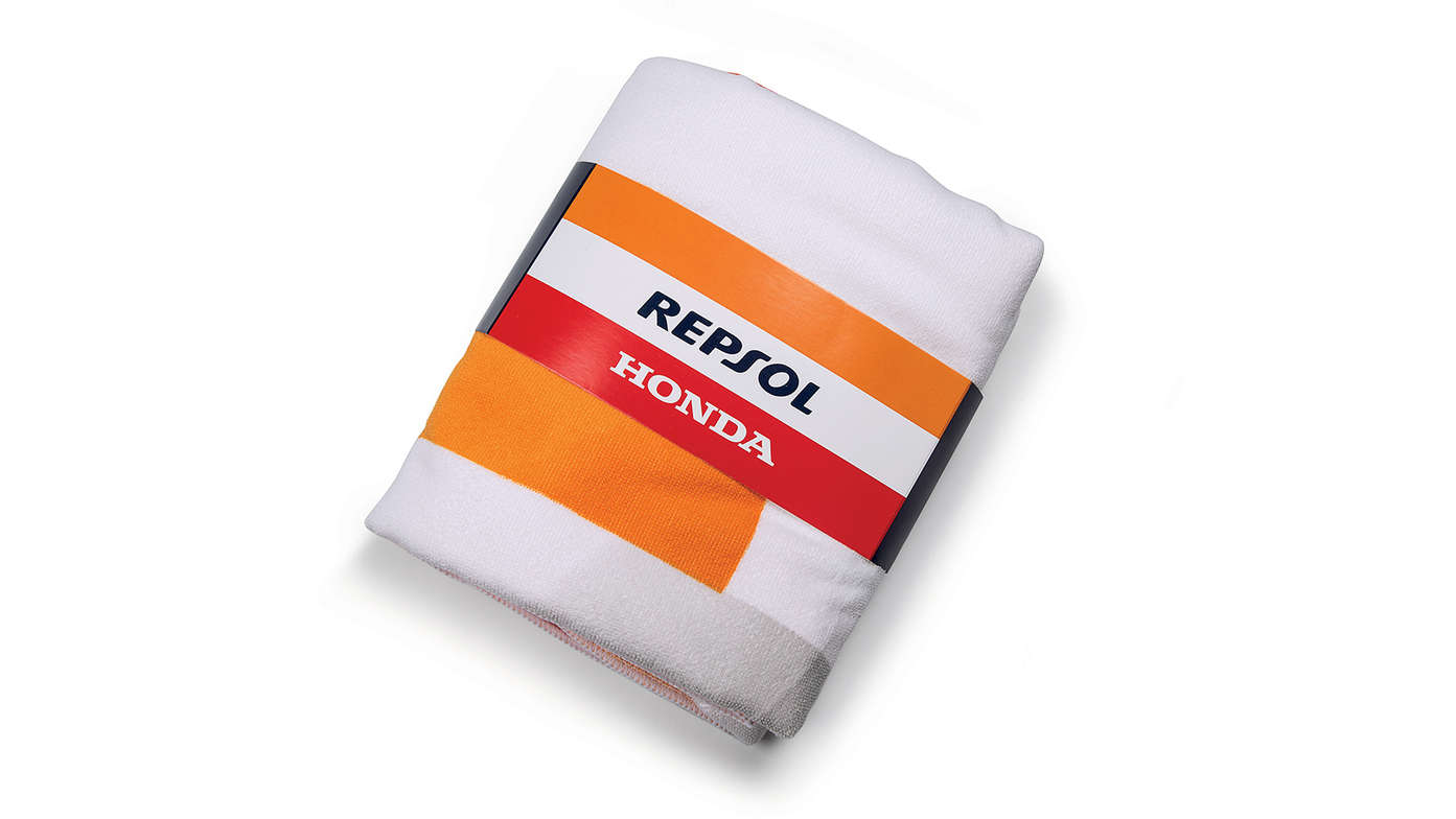 Honda Repsol strandlaken met Honda MotoGP-teamkleuren en Repsol-logo.