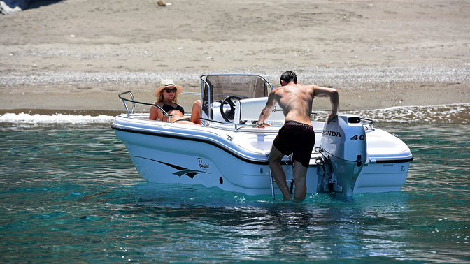 Man and woman enjoying a day out on a Ranieri boat with a Honda Marine Outboard Engine